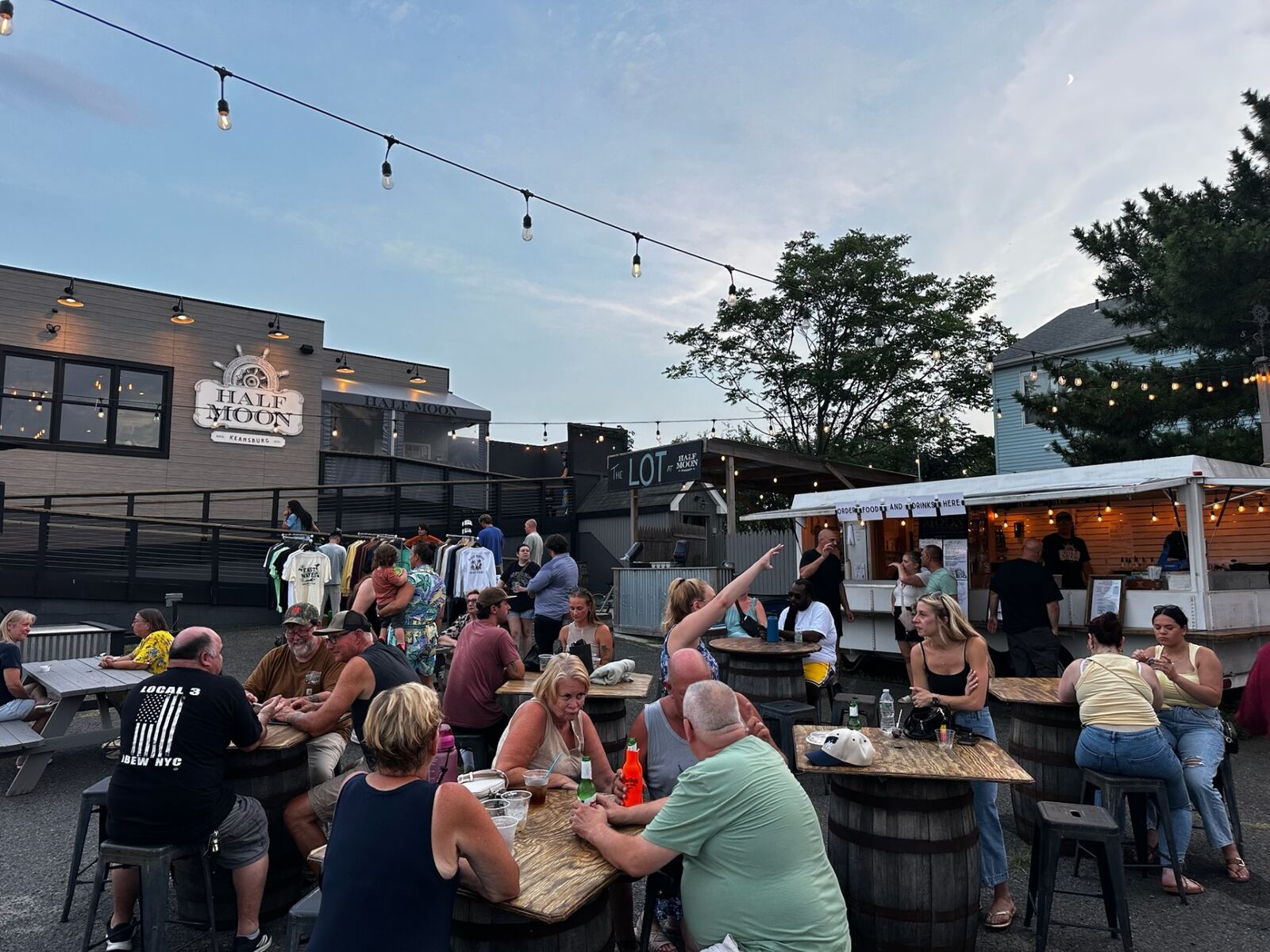 The Lot bar and shopping crowd at sunset
